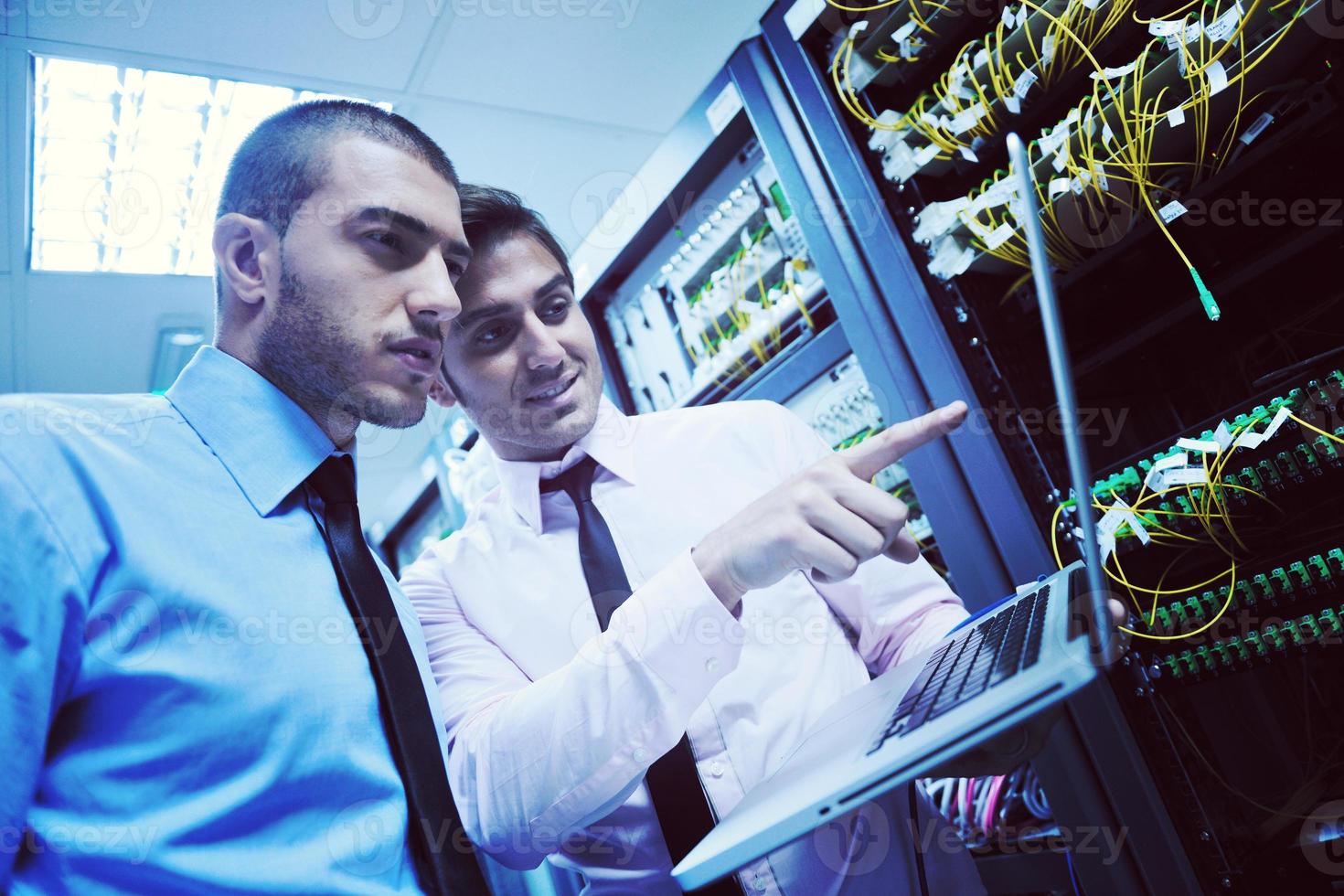 it engineers in network server room photo