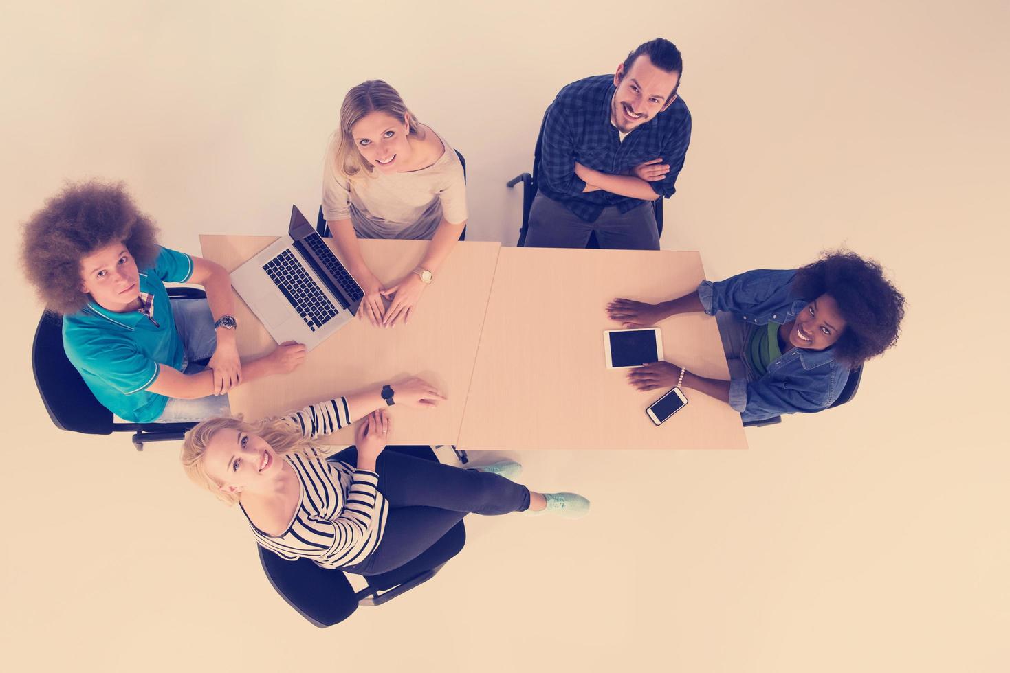 Multiethnic startup business team on meeting  top view photo