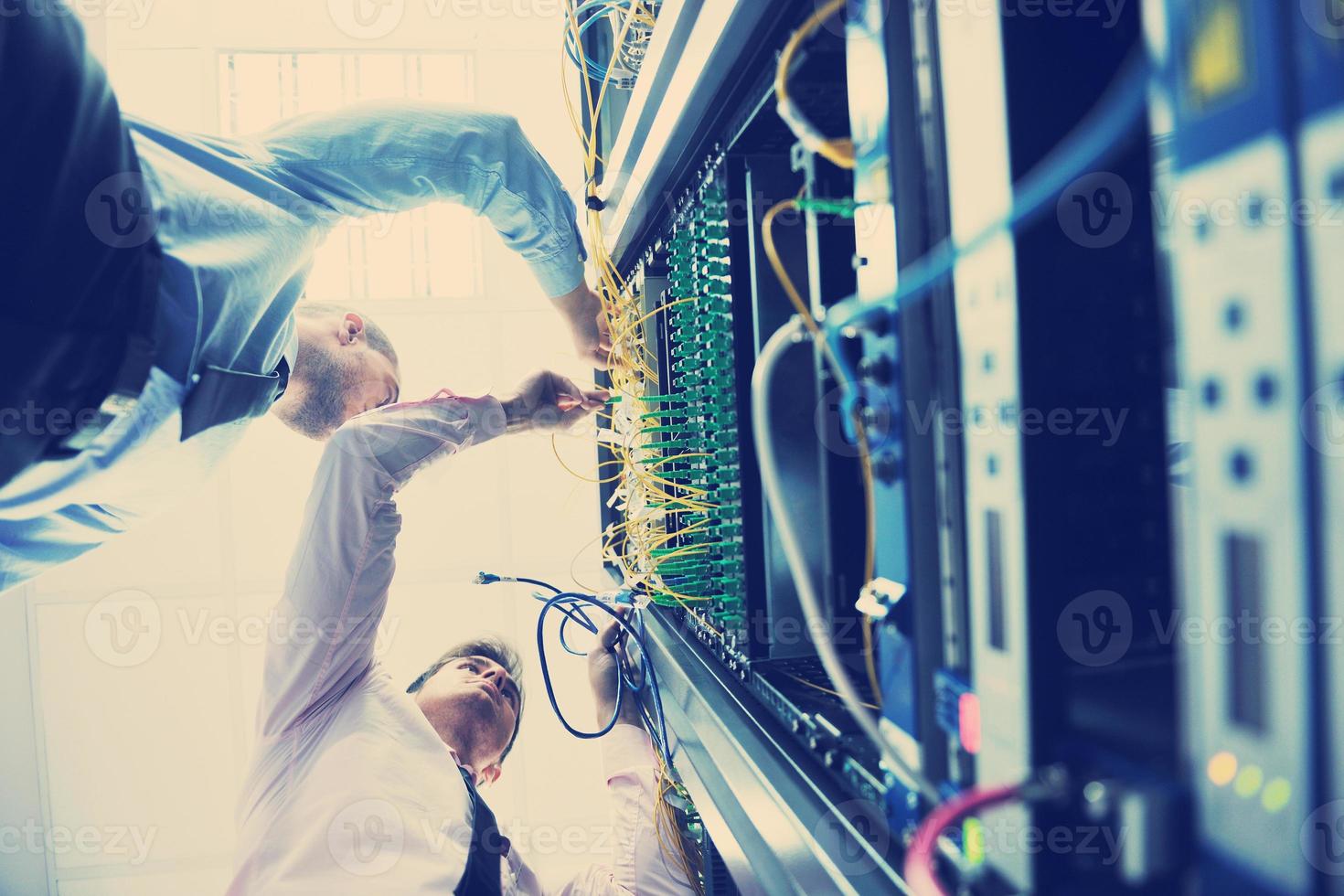 it engineers in network server room photo