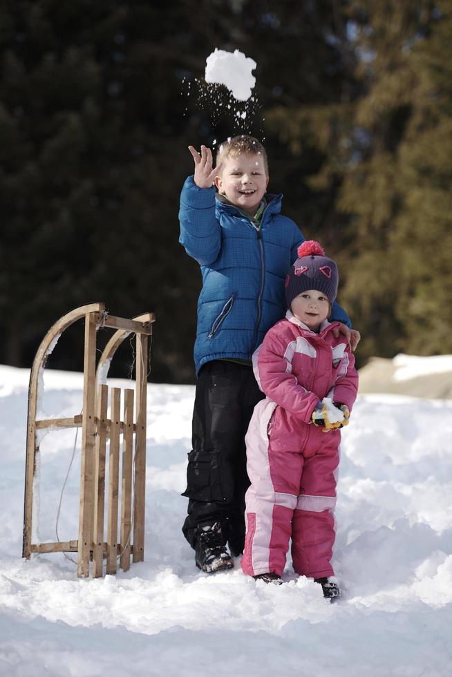 Brother and sister portrait in winter time photo