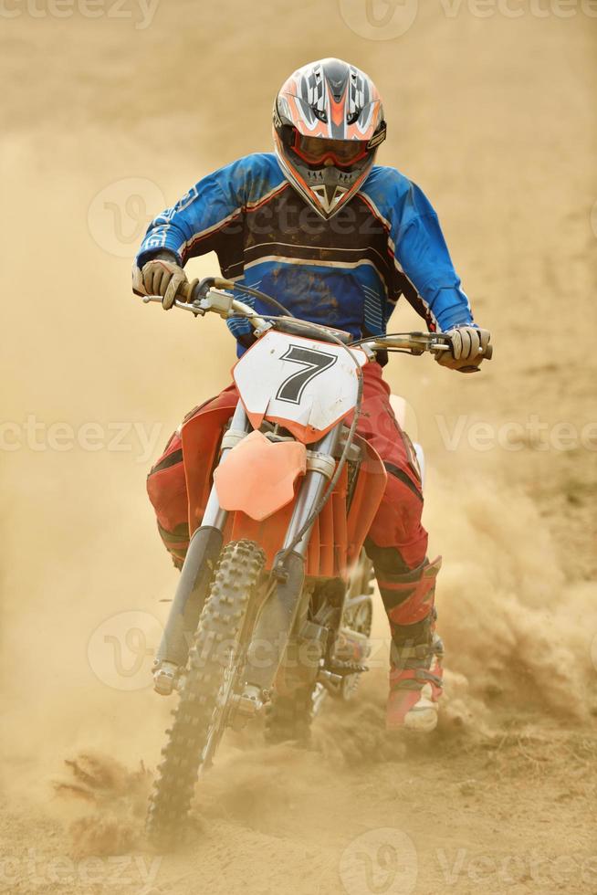 Riding a motocross bike photo