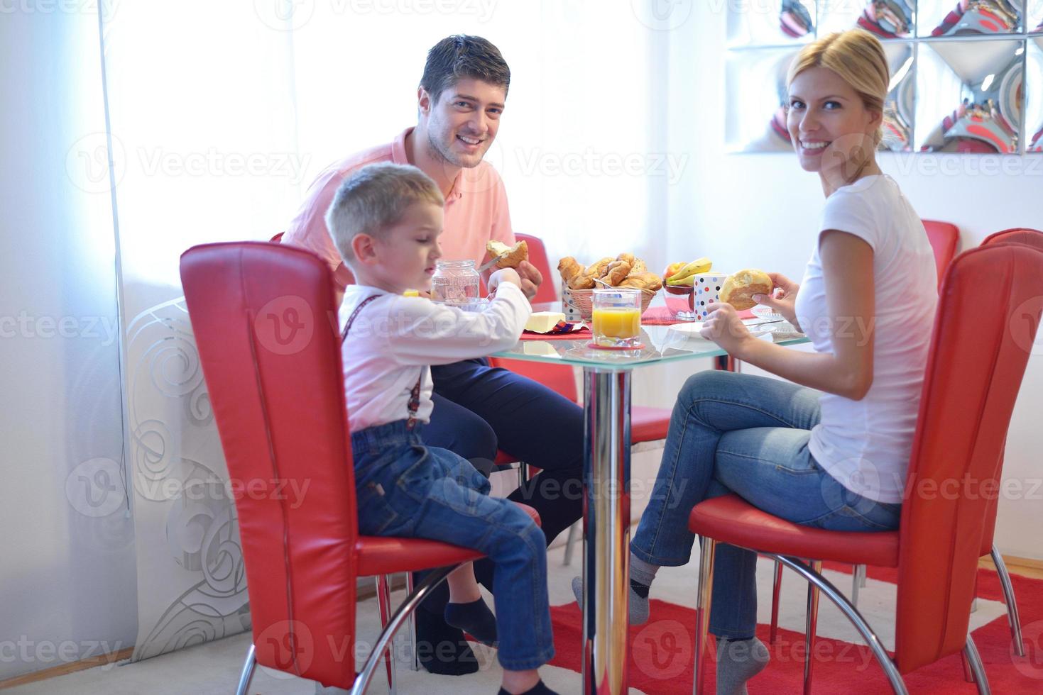 family have healthy breakfast at home photo