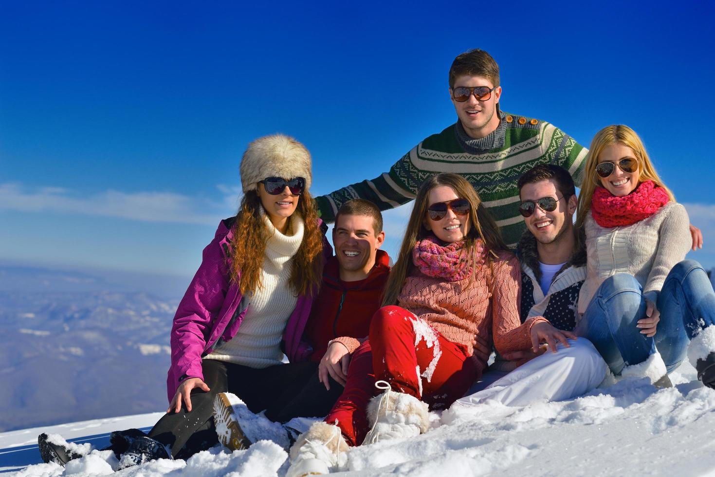 friends have fun at winter on fresh snow photo