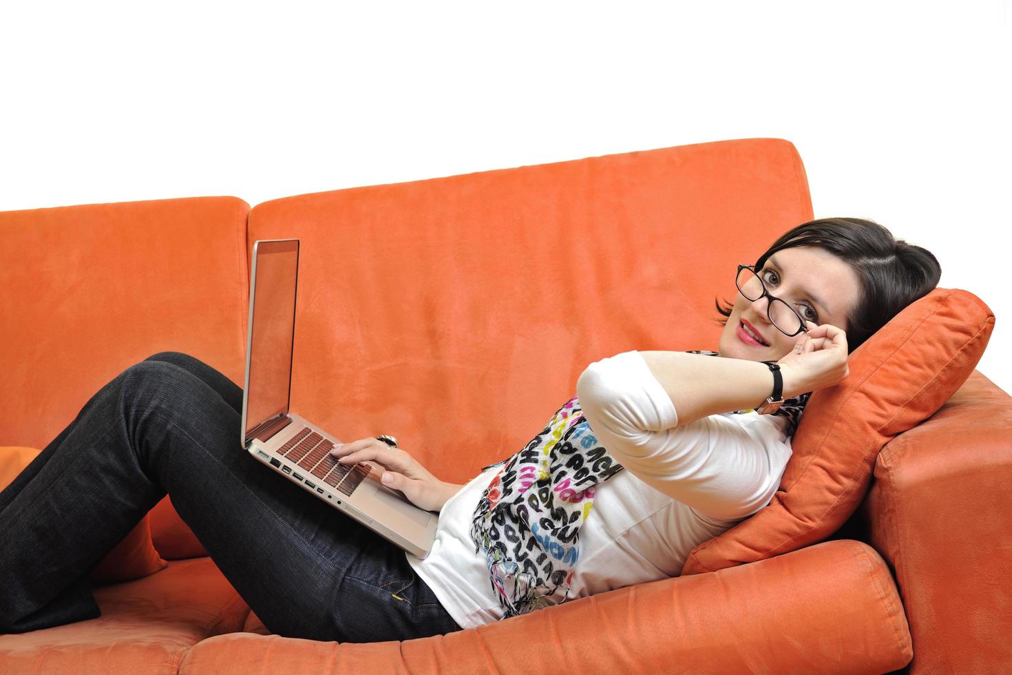 woman using a laptop computer at home photo