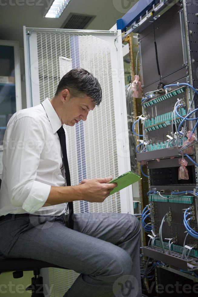 network engineer working in  server room photo