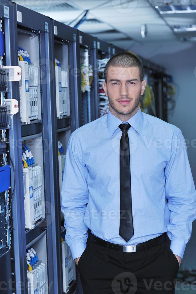 young it engeneer in datacenter server room photo