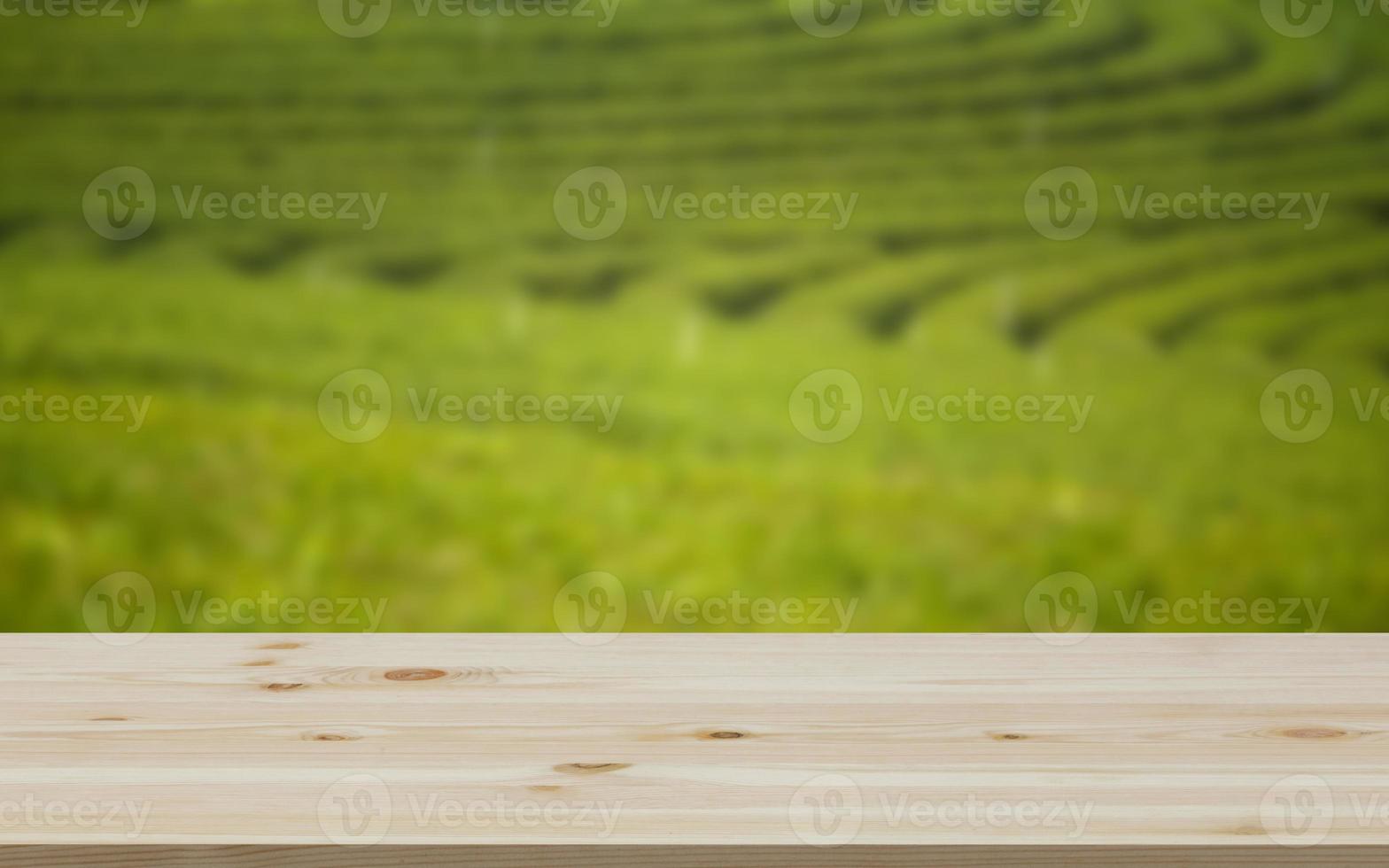 Empty wooden table with view of mountain or wooden desk with plantation nature with bokeh background, copy space for your text photo
