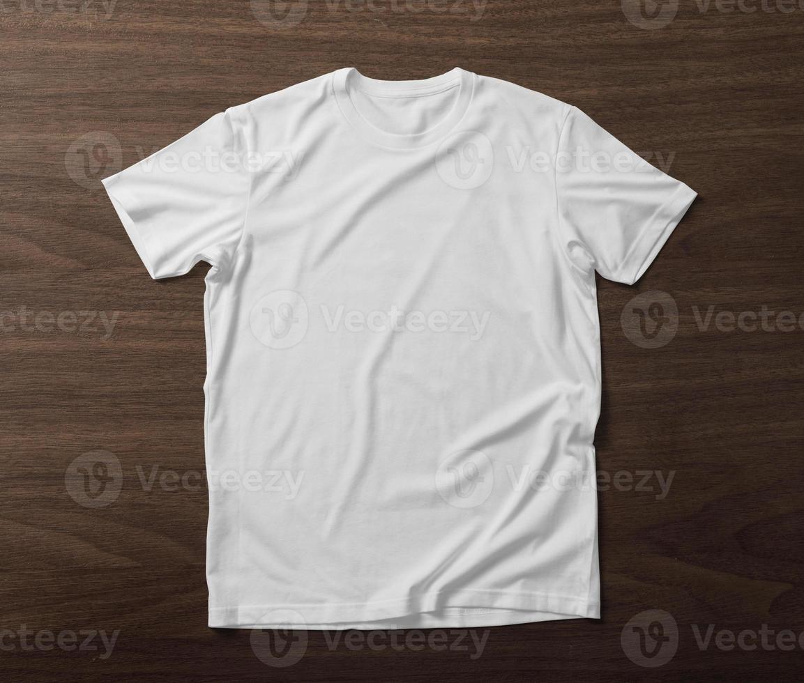 Front side of T-Shirt mockup template on wooden background photo