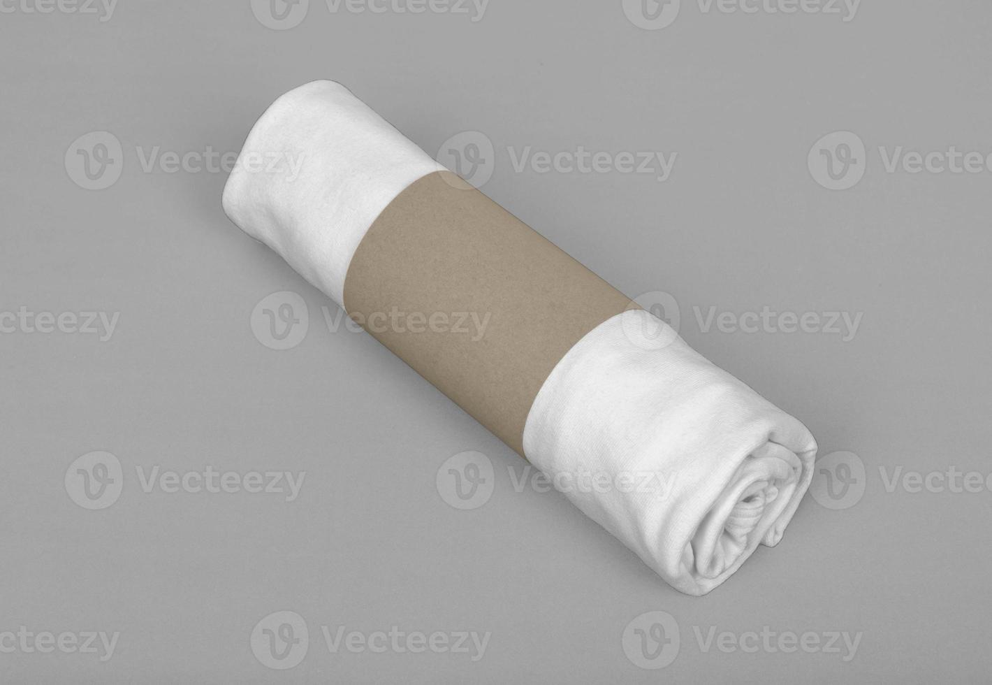 Package with white T-shirt roll mockup template with copy space for your logo or graphic design photo