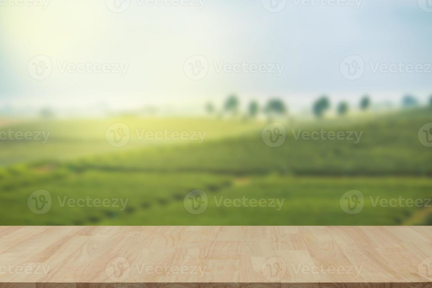 Empty wooden table with view of mountain or wooden desk with plantation nature with bokeh background, copy space for your text photo