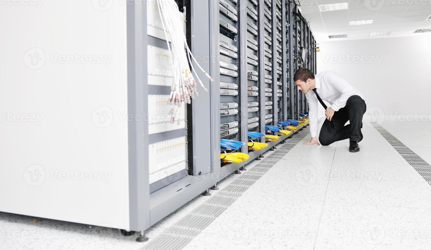 young it engeneer in datacenter server room photo