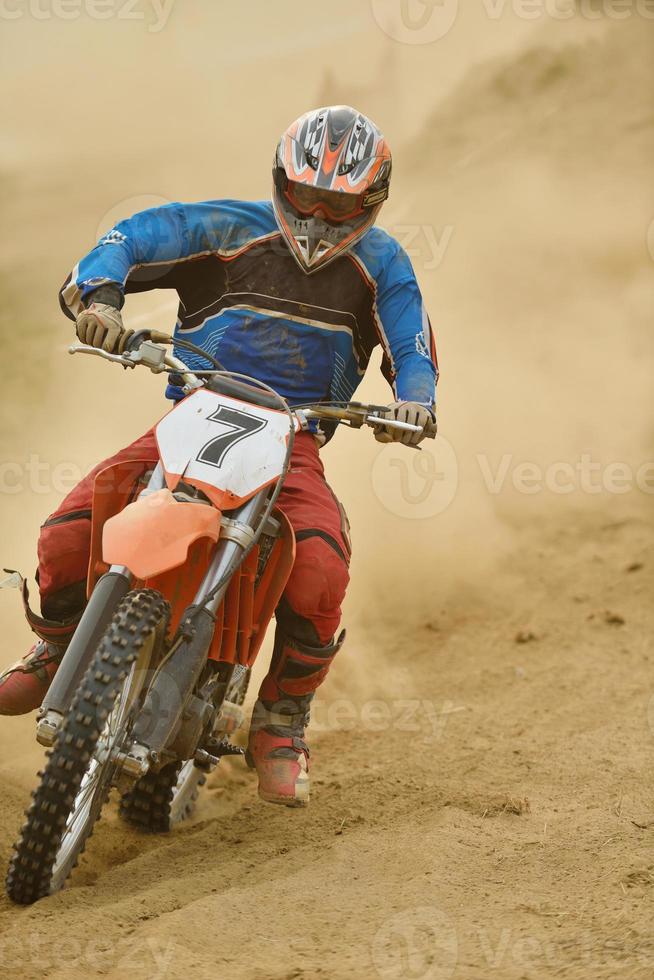 Riding a motocross bike photo