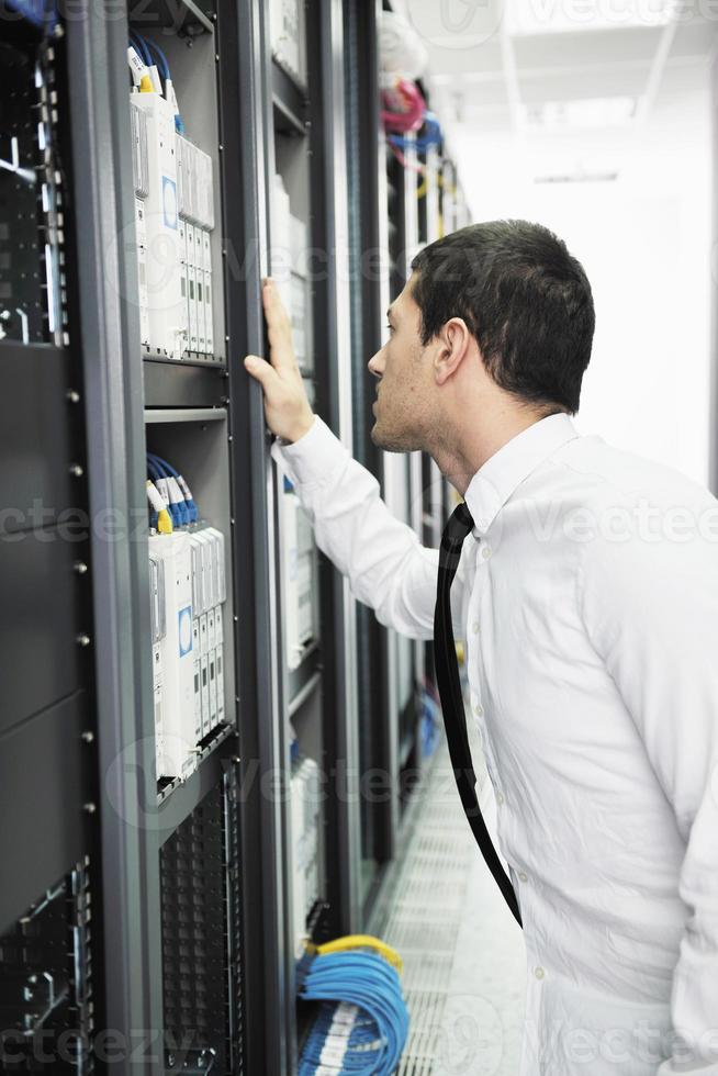 young it engeneer in datacenter server room photo