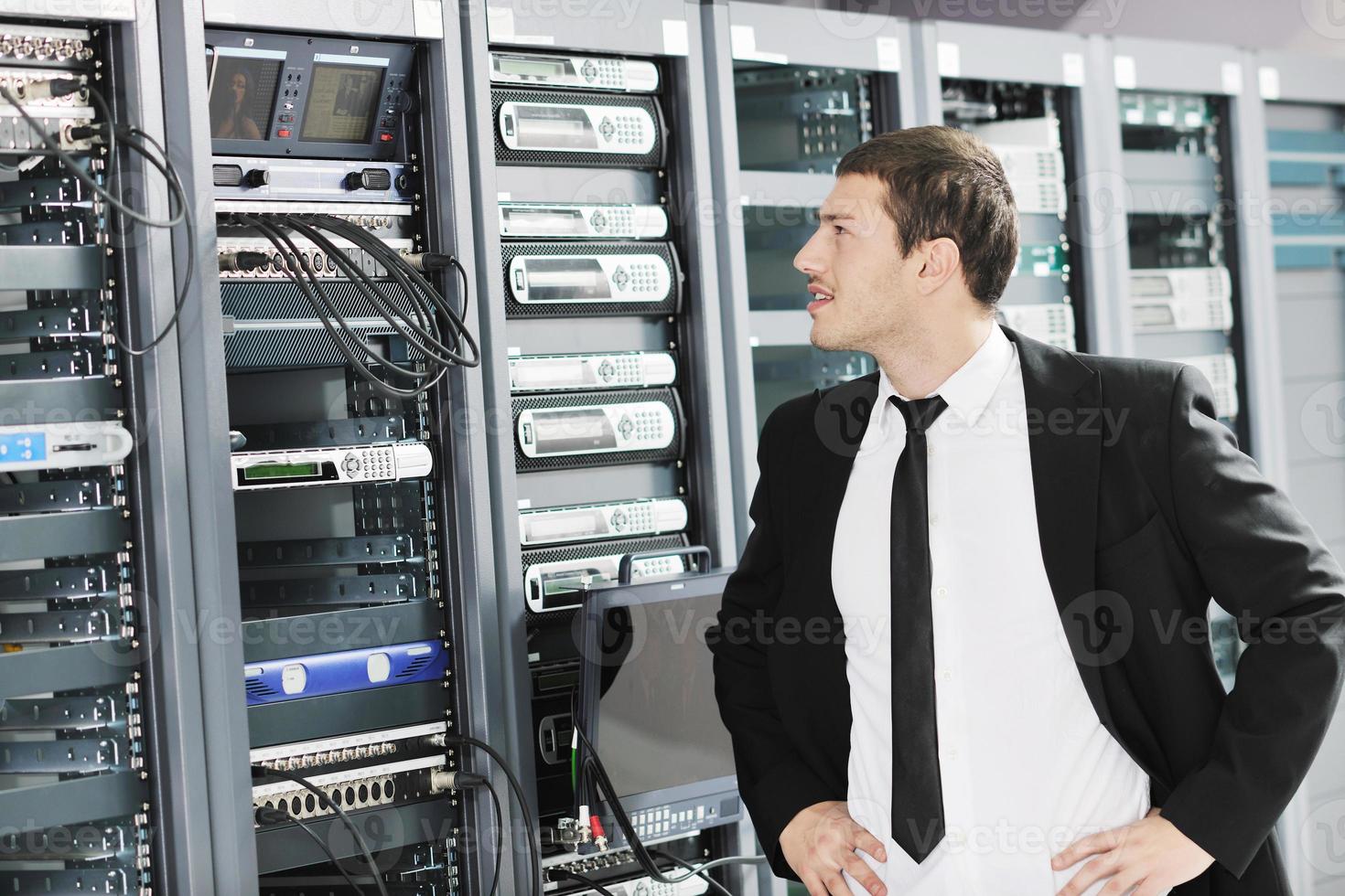 young it engeneer in datacenter server room photo