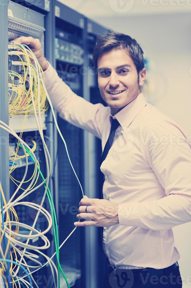 young it engeneer in datacenter server room photo