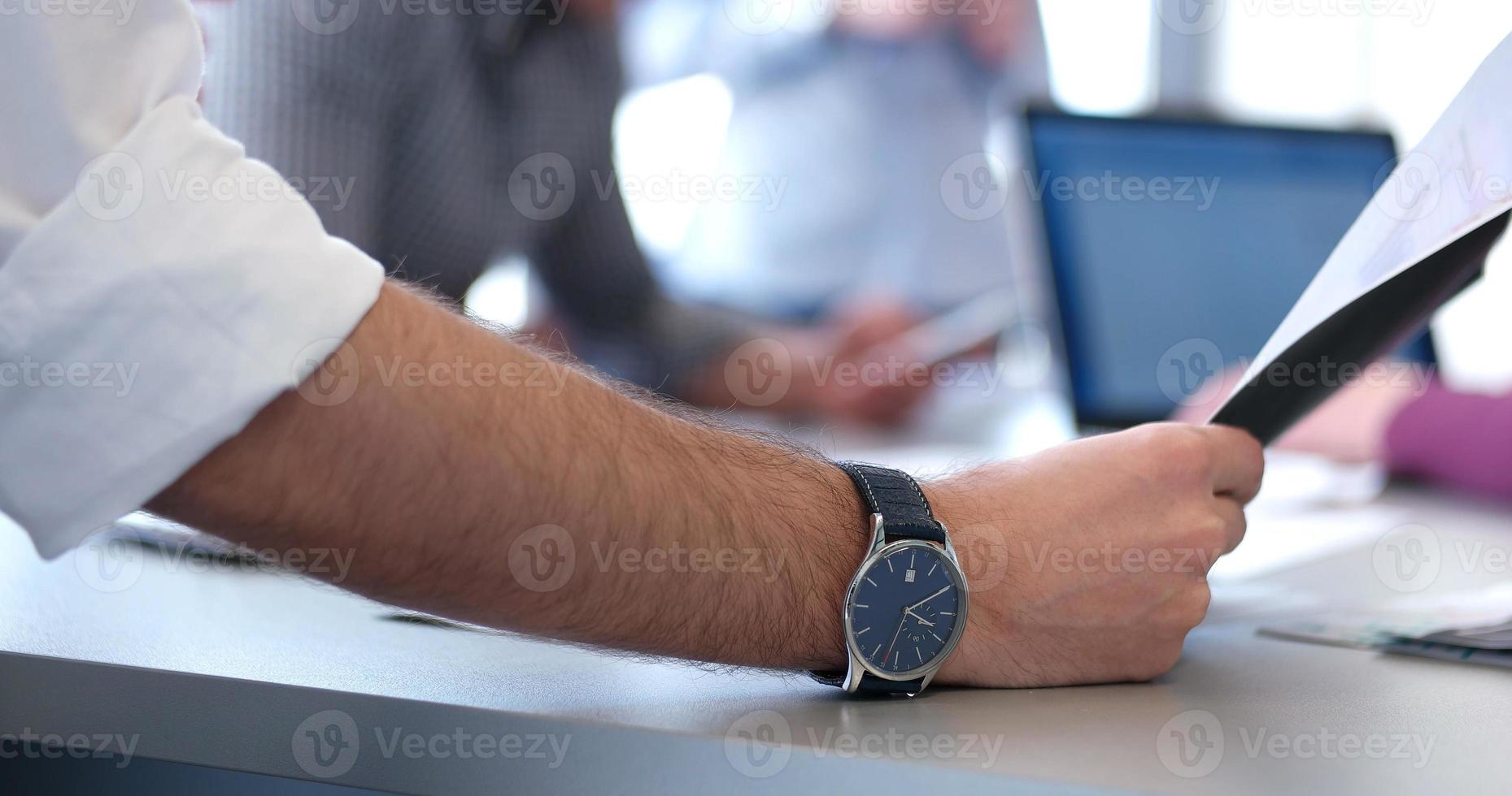 office and teamwork concept - group of business people having a meeting photo