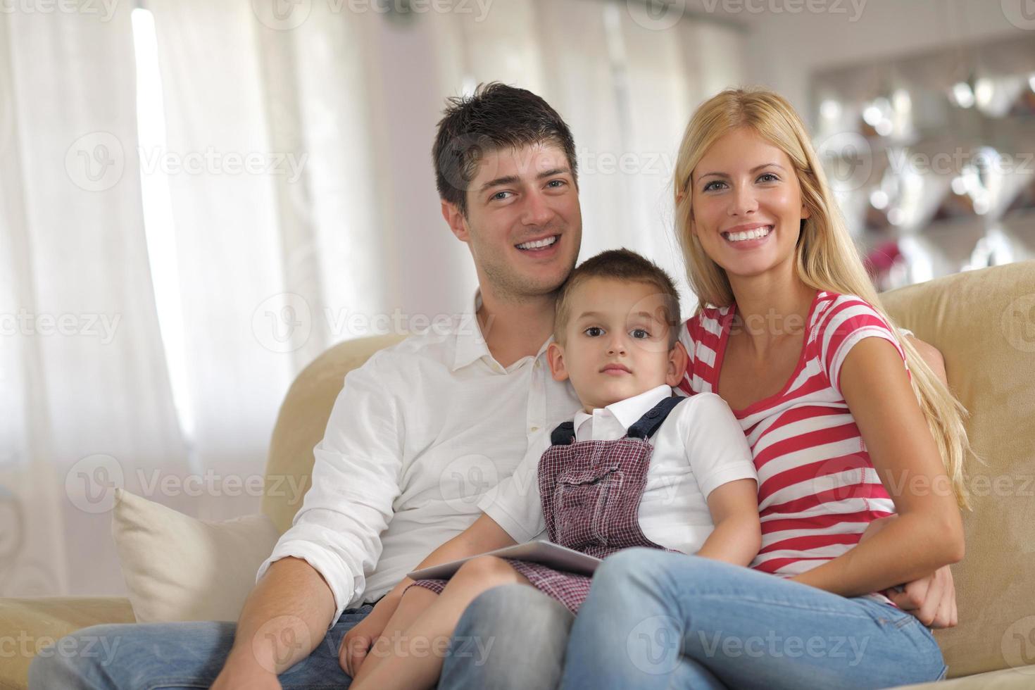 family at home using tablet computer photo