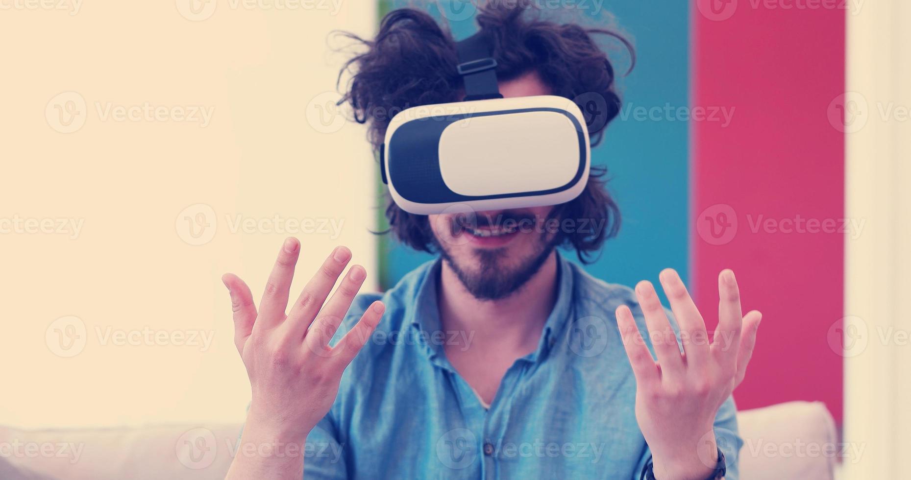 man using VR-headset glasses of virtual reality photo