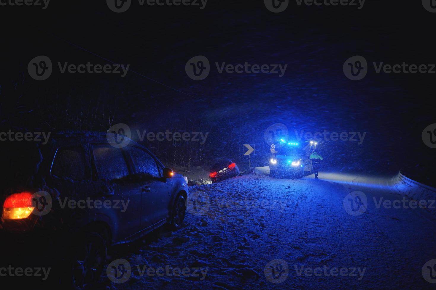 car accident on slippery winter road at night photo