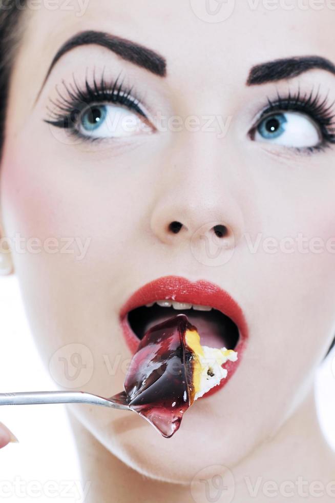 beautiful young woman eat sweet cake photo