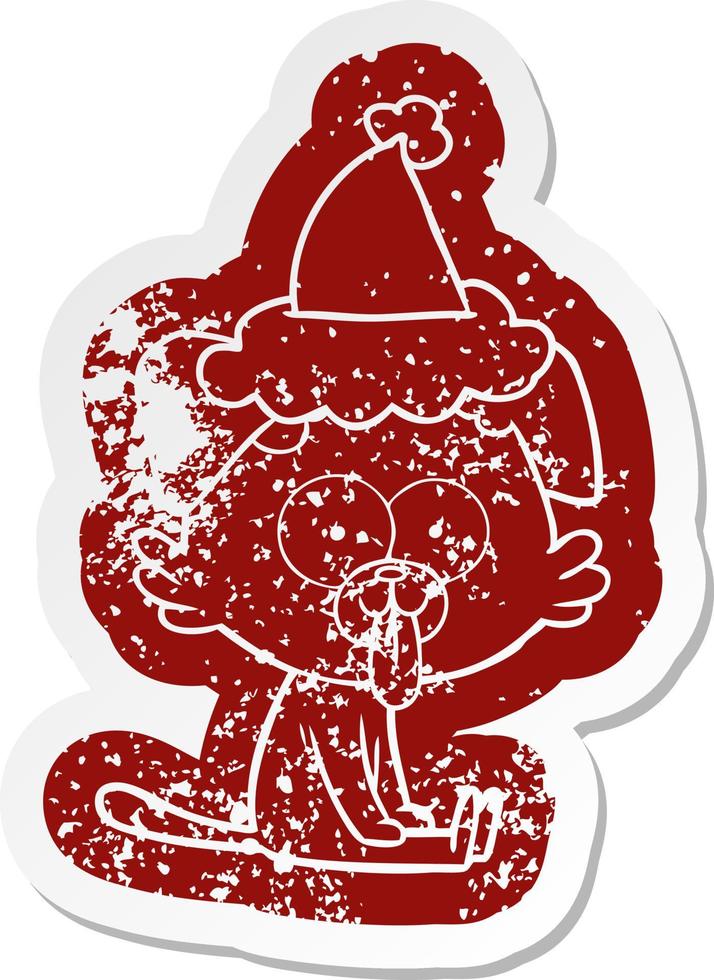 cartoon distressed sticker of a sitting dog with tongue sticking out wearing santa hat vector