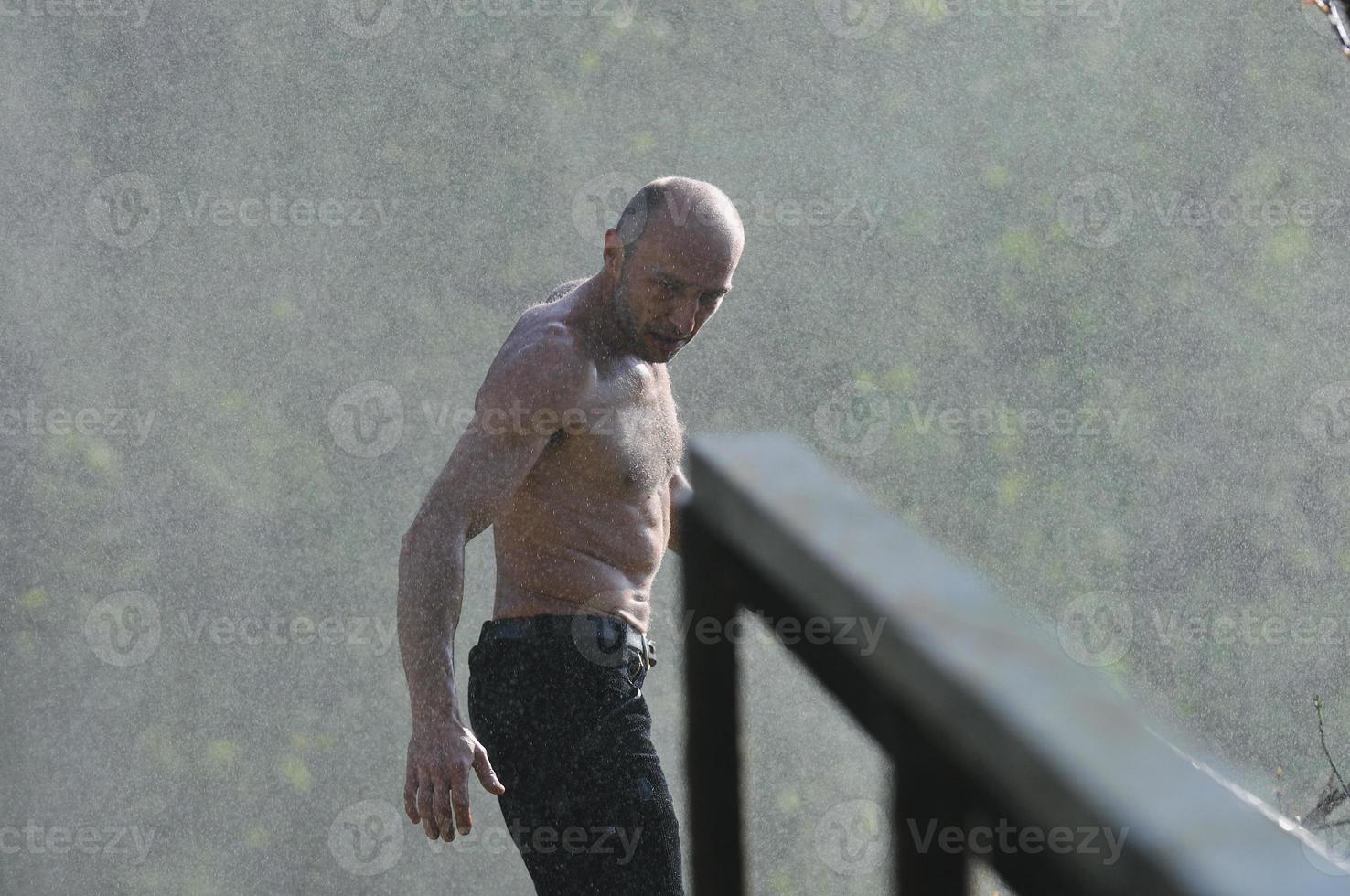 Man in waterfall photo