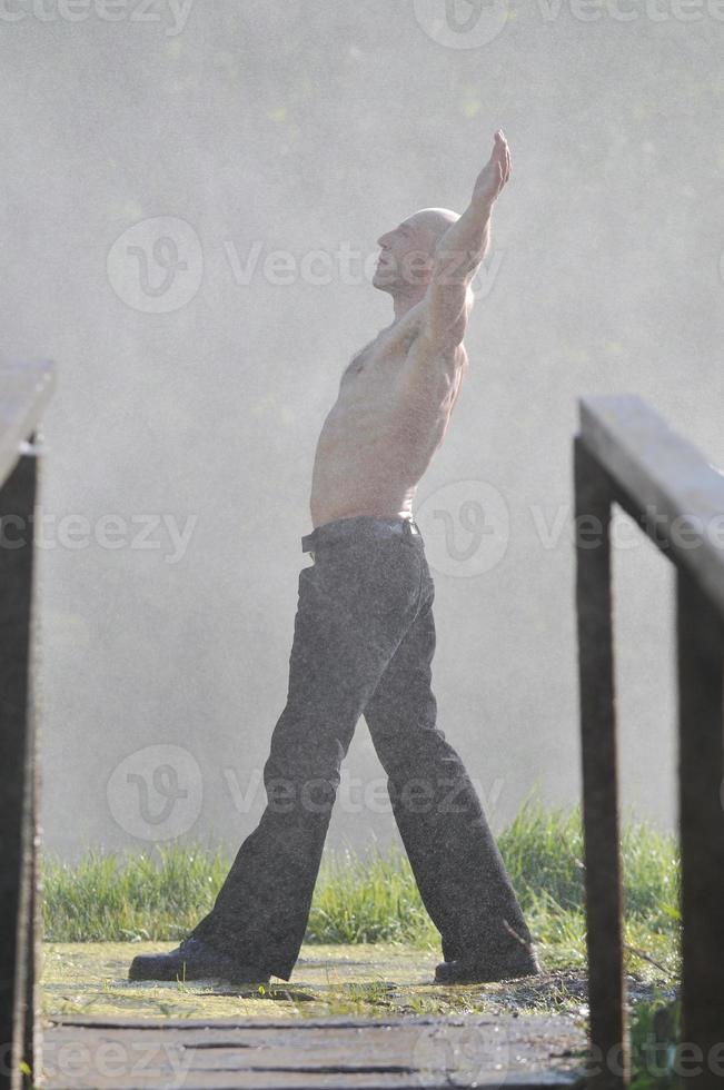 Man in waterfall photo