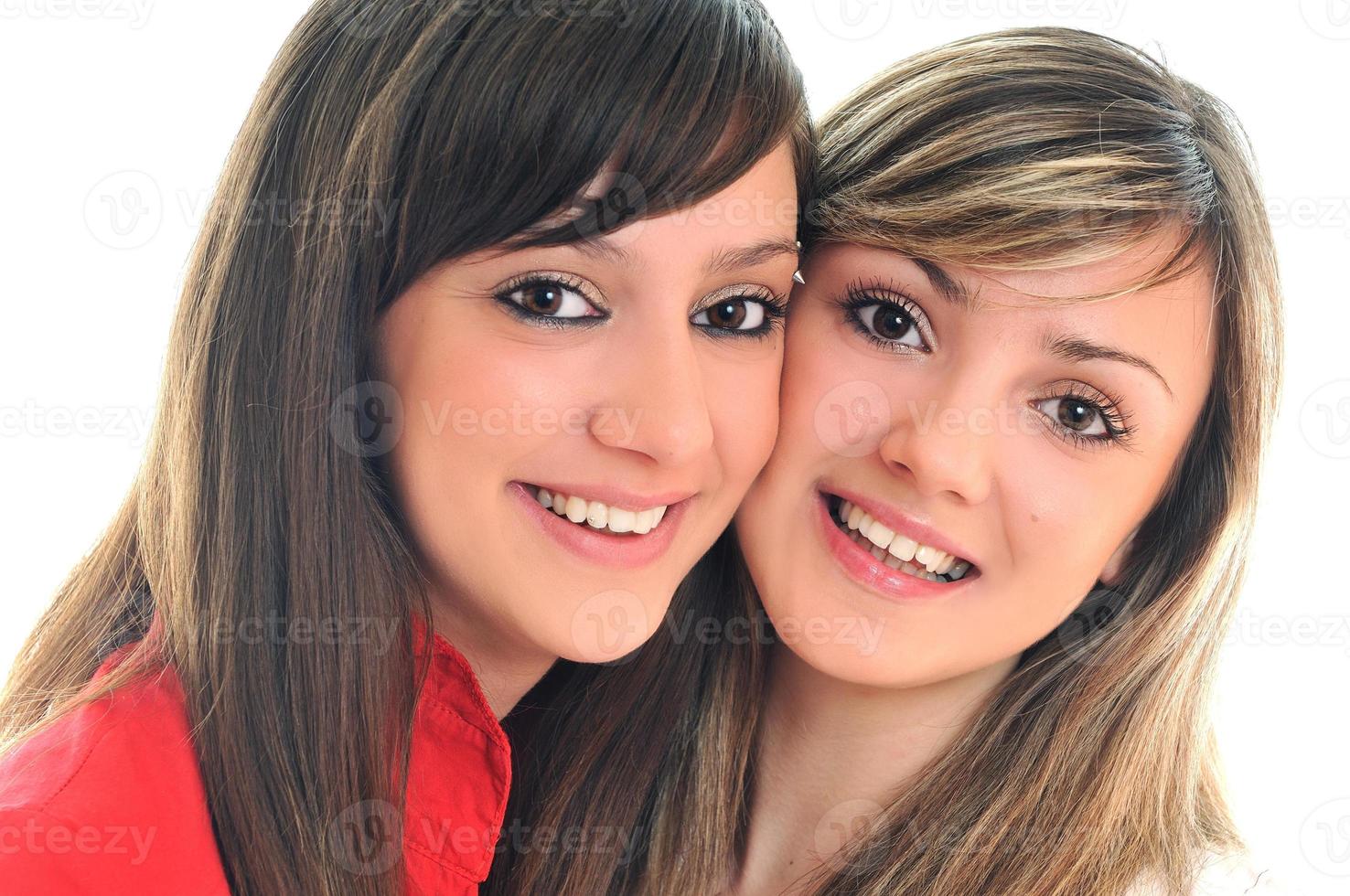 dos niñas aisladas en blanco foto