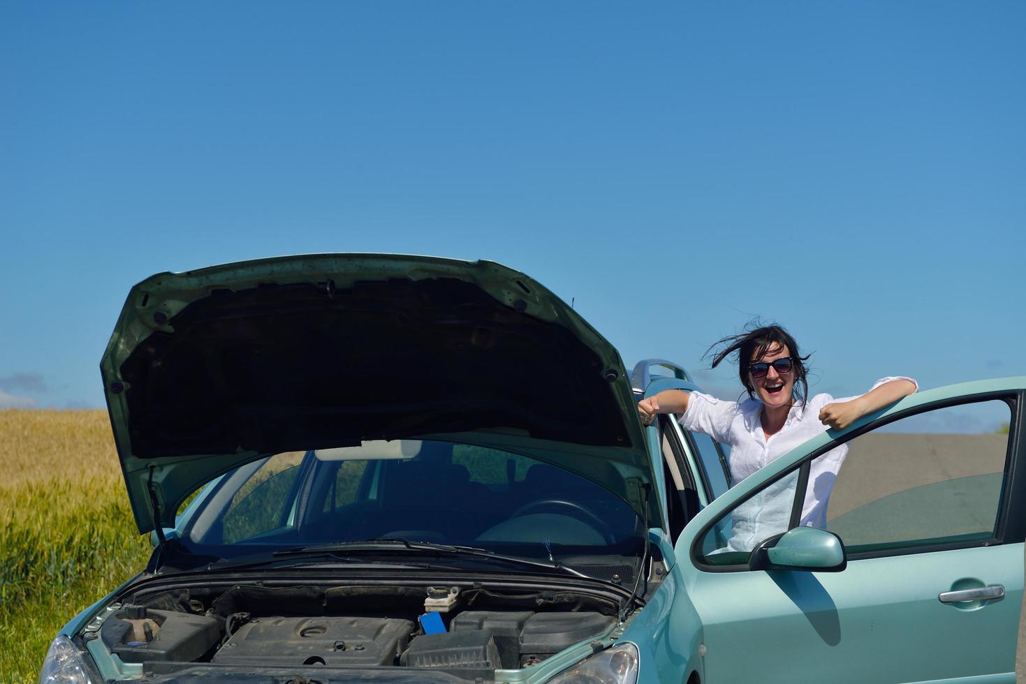 woman with broken car photo