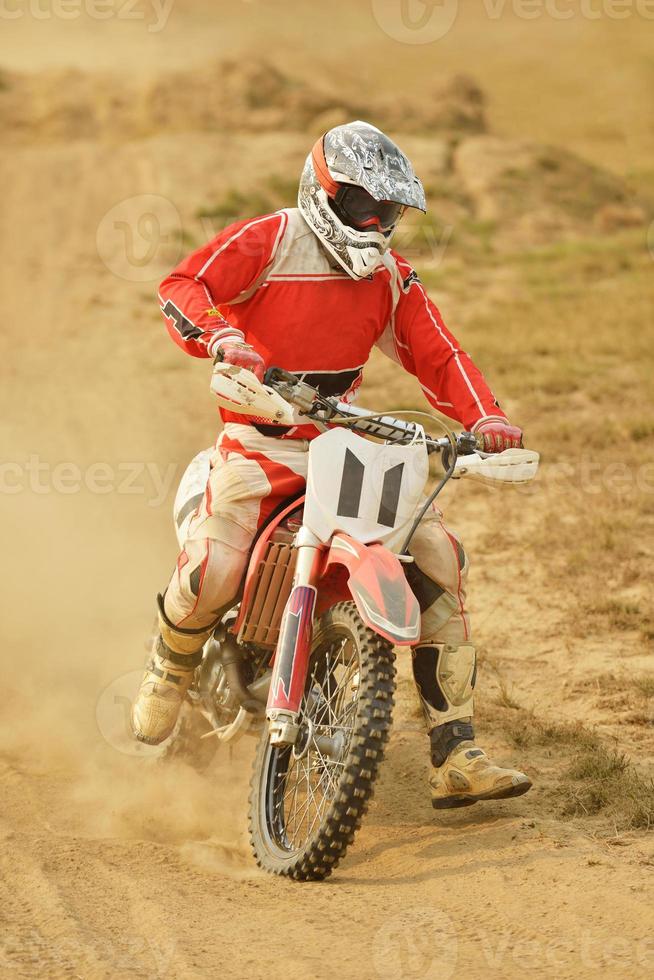 Riding a motocross bike photo