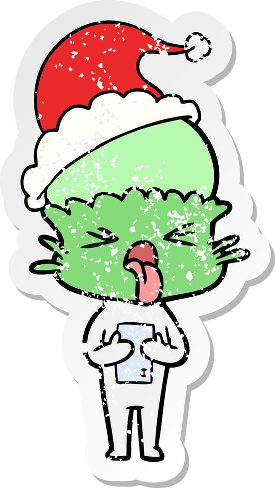 disgusted distressed sticker cartoon of a alien wearing santa hat vector