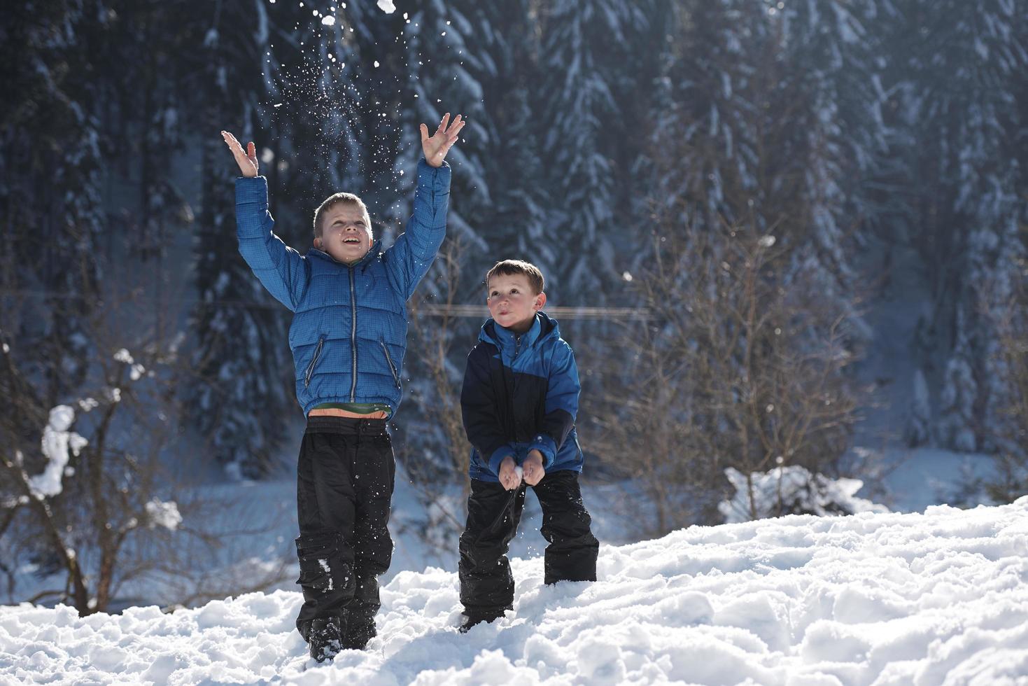 kids playing with  fresh snow photo