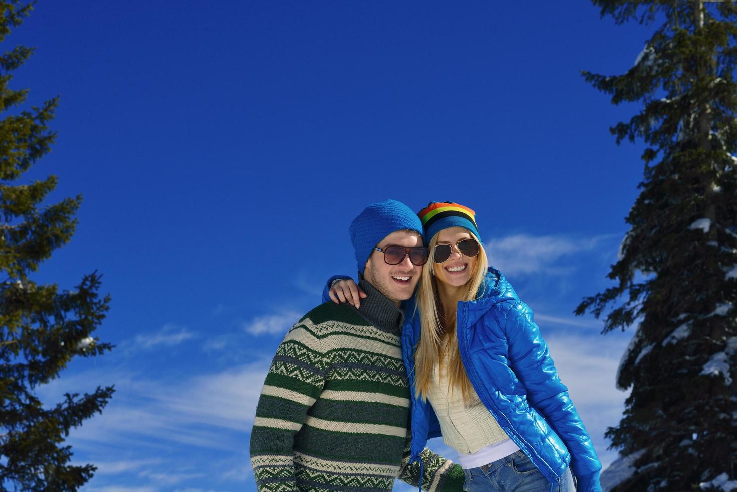 young couple on winter vacation photo