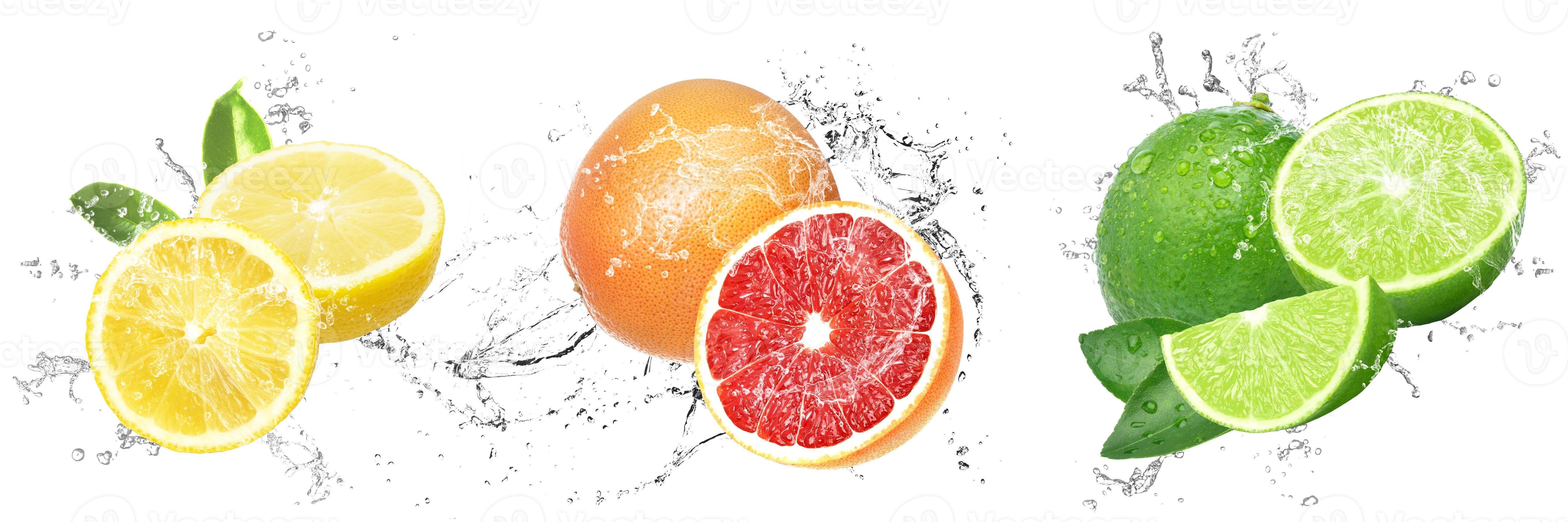 Fresh Fruits with water splash with drops on isolated white background. Lemon, Lime and