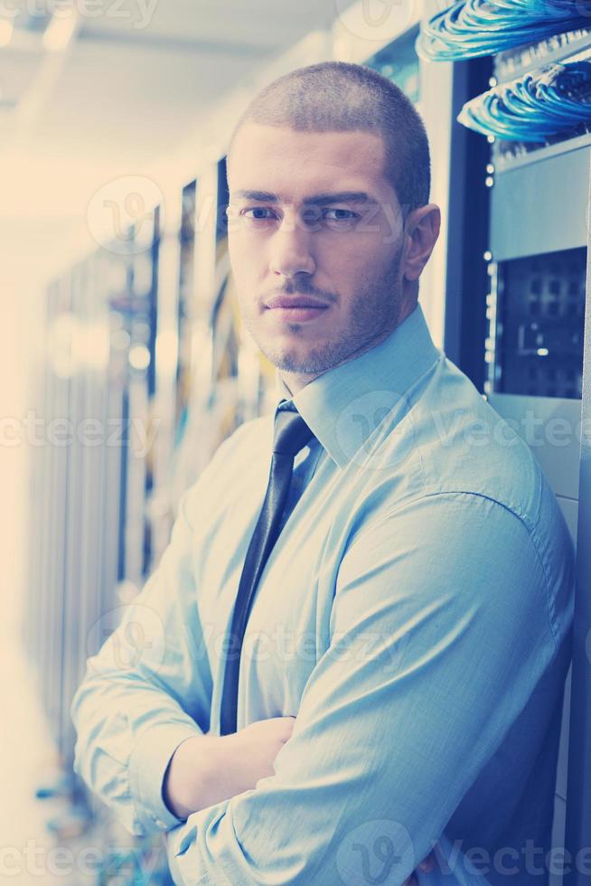 young it engeneer in datacenter server room photo