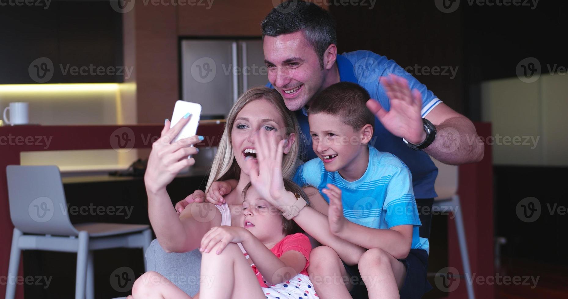 Family relaxing in living room photo