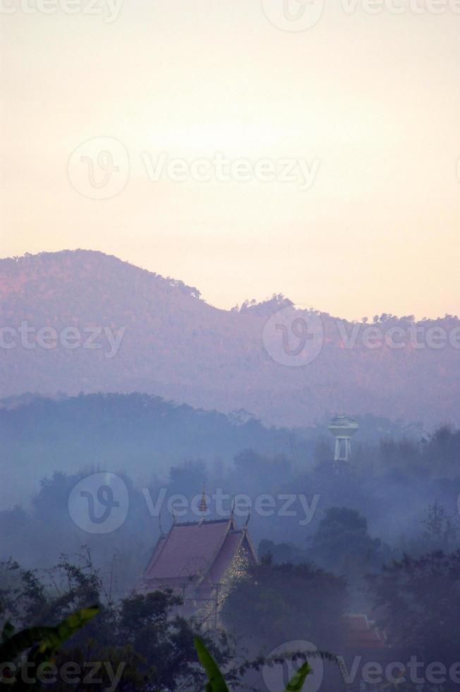 Morning mist and mountain view in the countryside photo