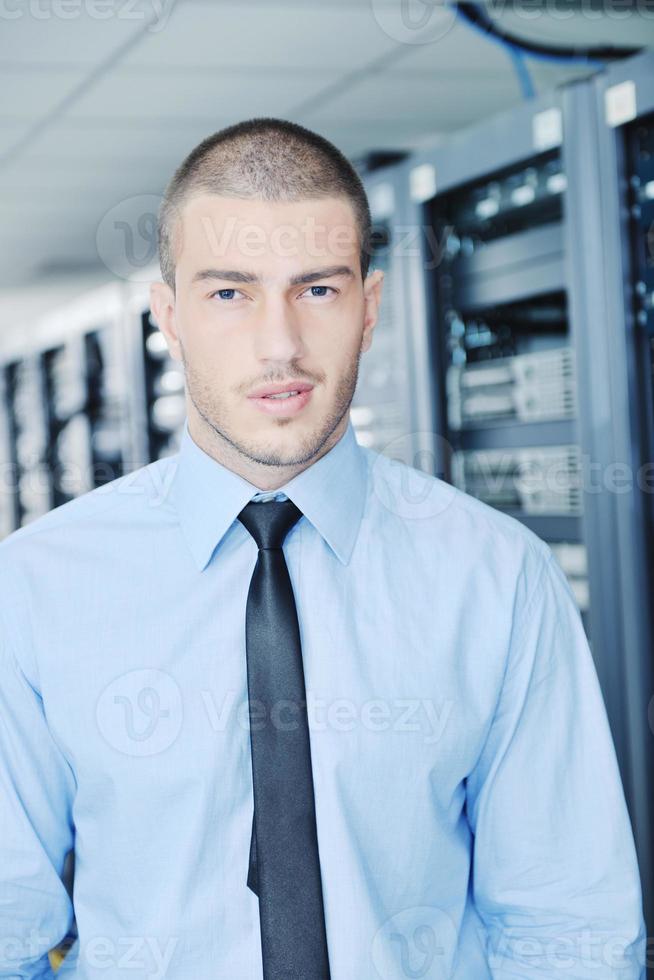 young it engeneer in datacenter server room photo