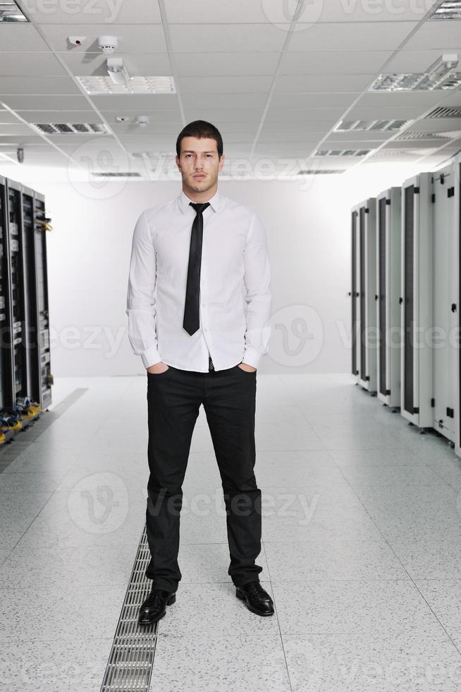 young it engeneer in datacenter server room photo