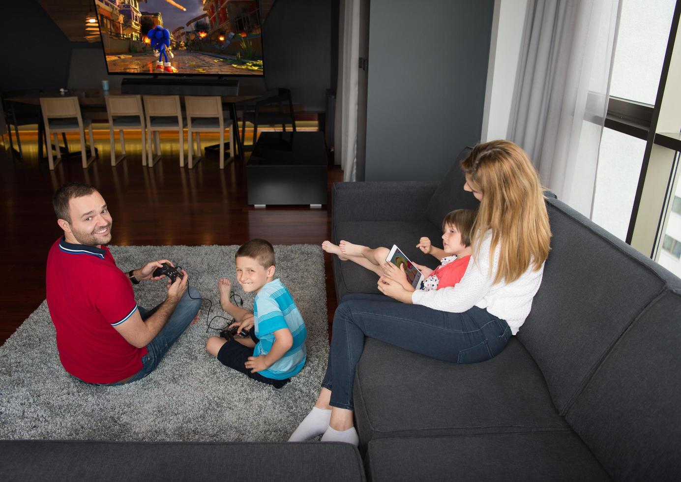Happy family playing a video game photo