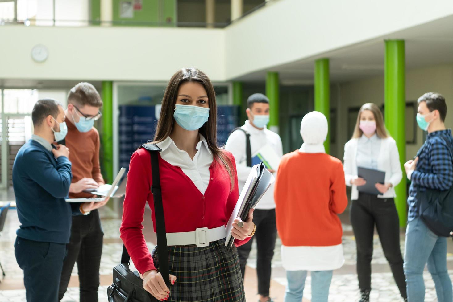 Portrait of multiethnic students group at university wearing protective face mask photo