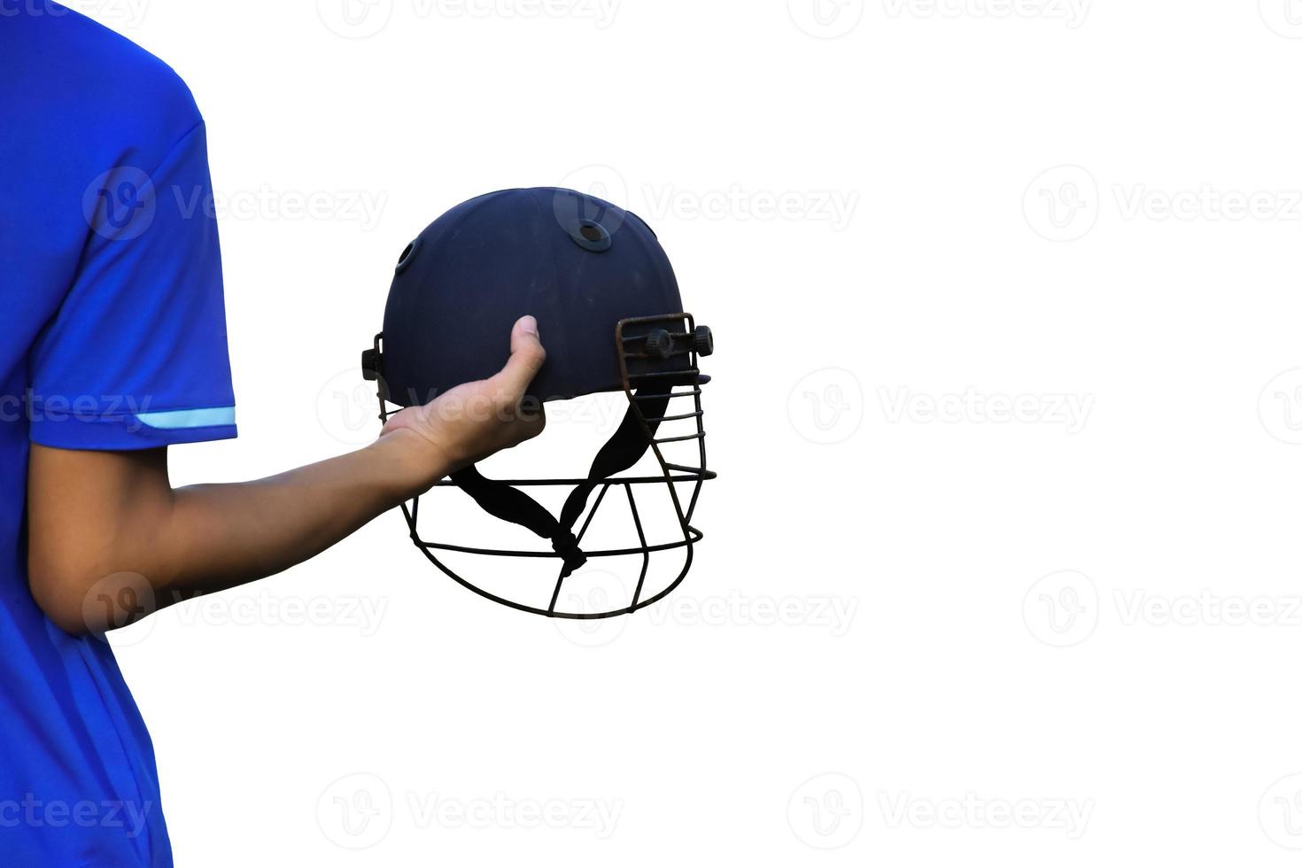 Isolated cricketer holds cricket helmet on white background with clipping paths. photo