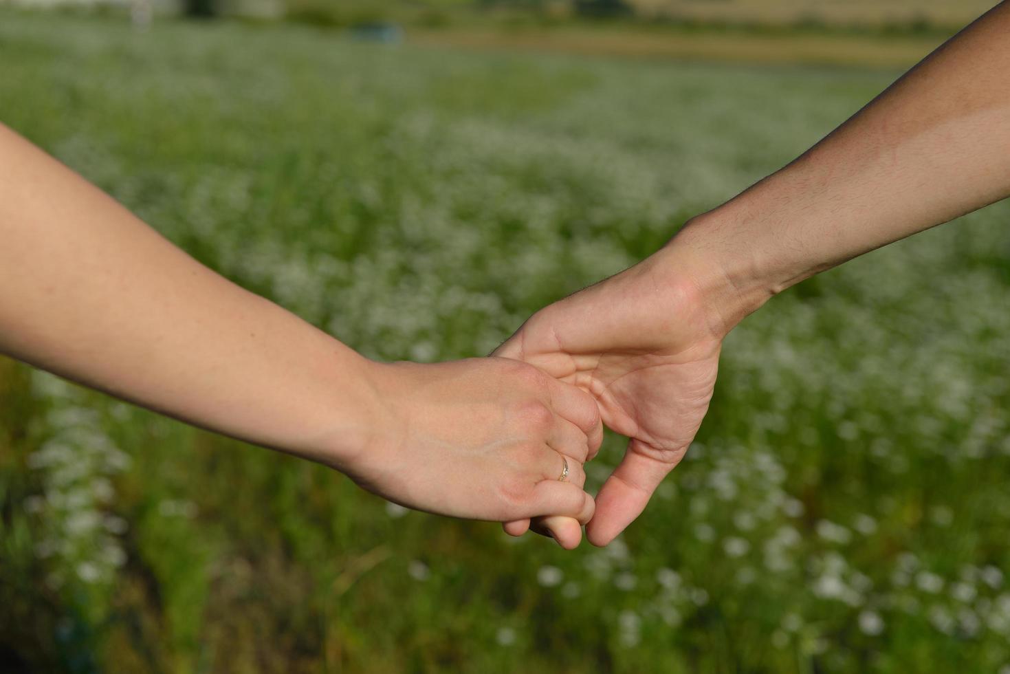 Holding hands outside photo