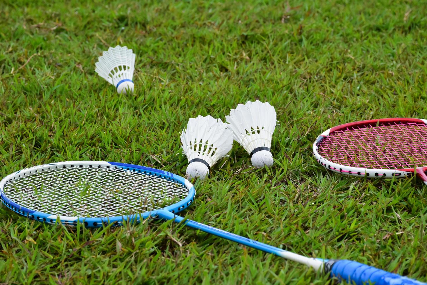 Badminton racket and badminton shuttlecock against cloudy and bluesky background, outdoor