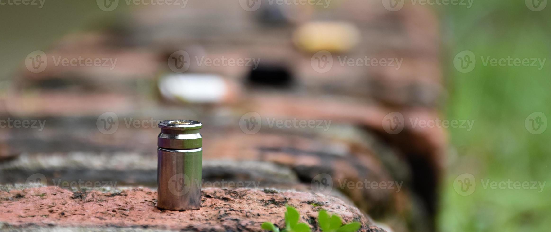 9mm pistol bullet shells on brick floor, soft and selective focus, concept for searching a key piece of evidence in a murder case at the scene. photo