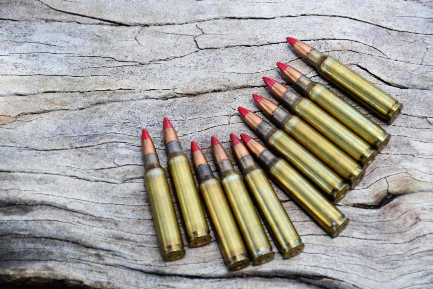 Closeup view of the old bullets on jeans floor, soft and selective focus on bullets, concept for collecting old bullets in free times. photo