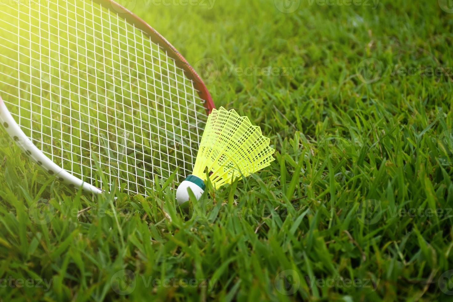 Badminton outdoors equipments shuttlecocks and badminton rackets, on grasslawn, soft and selective focus on shuttlecocks, outdoor badminton playing concept photo