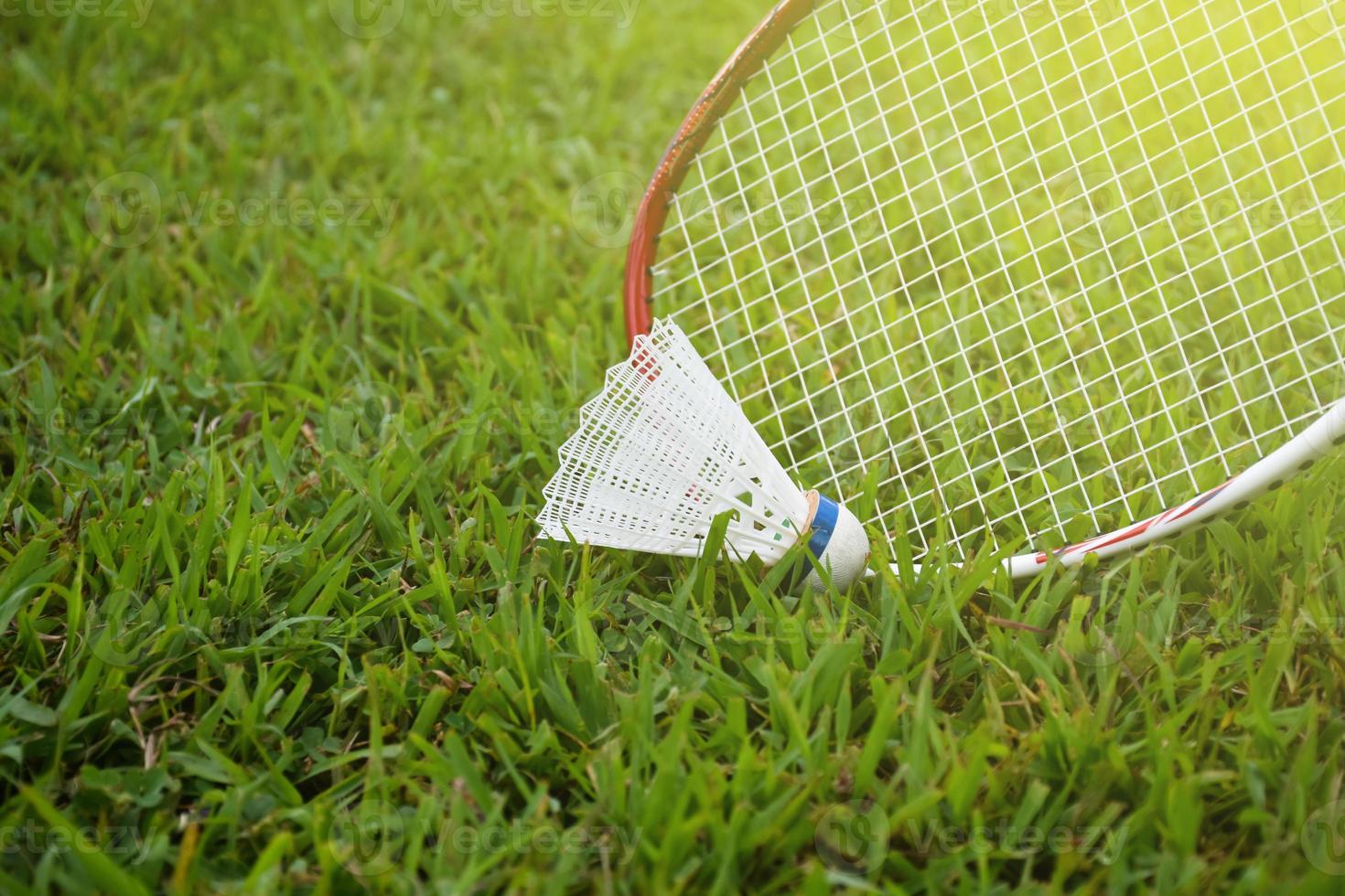 Badminton outdoors equipments shuttlecocks and badminton rackets, on grasslawn, soft and selective focus on shuttlecocks, outdoor badminton playing concept photo