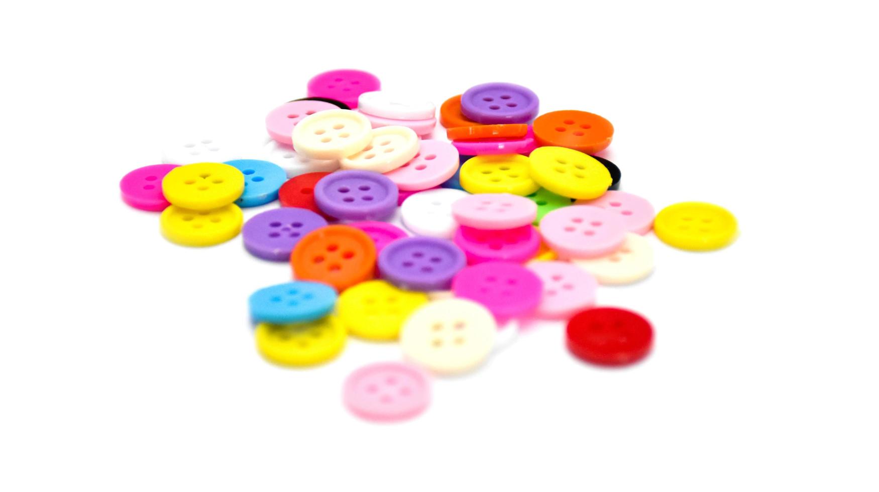 colorful various buttons on white background, soft and selective focus. photo