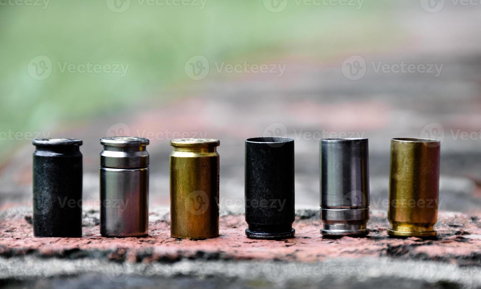 9mm pistol bullet shells on brick floor, soft and selective focus, concept for searching a key piece of evidence in a murder case at the scene. photo
